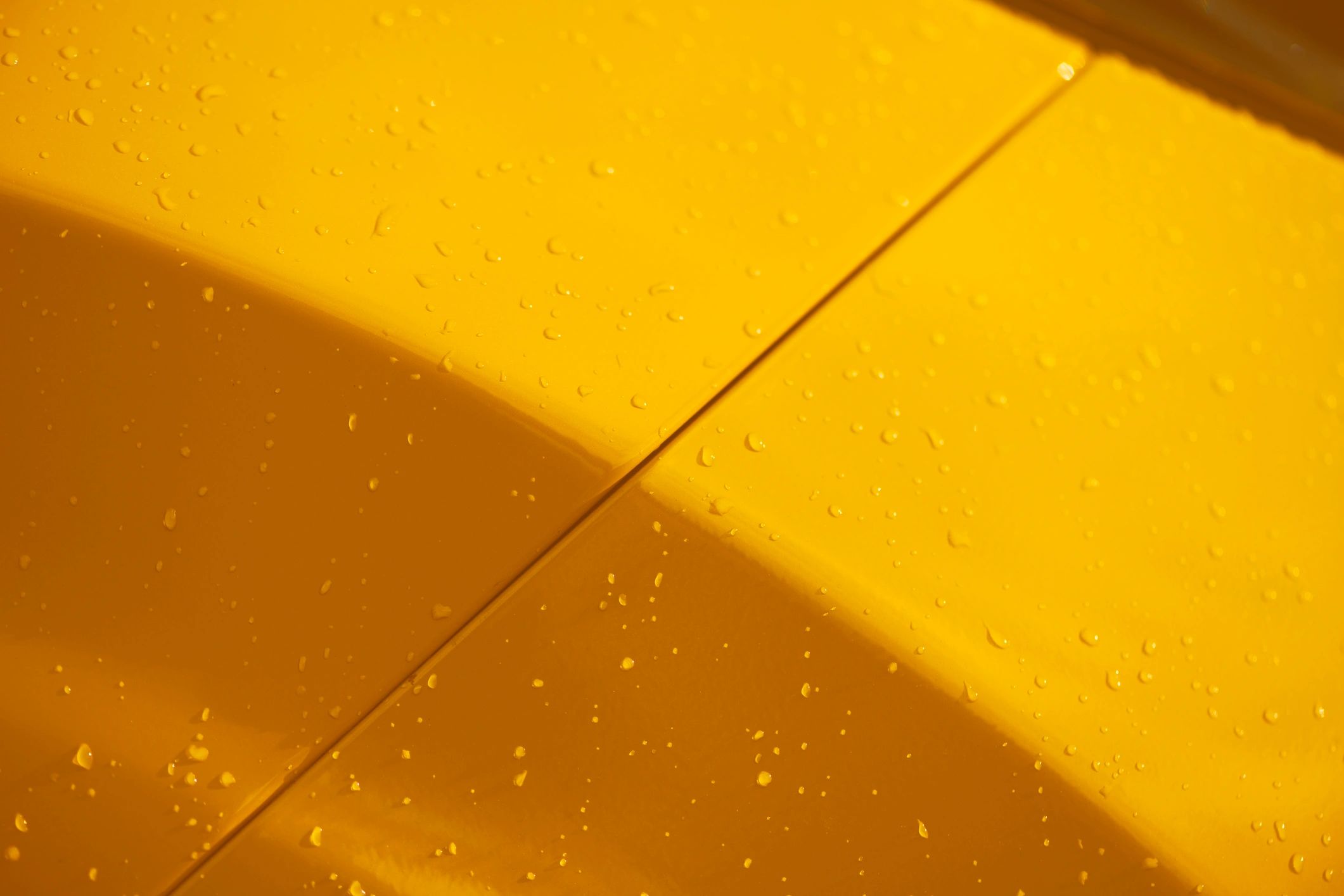 Close-up of a yellow vehicle body panel