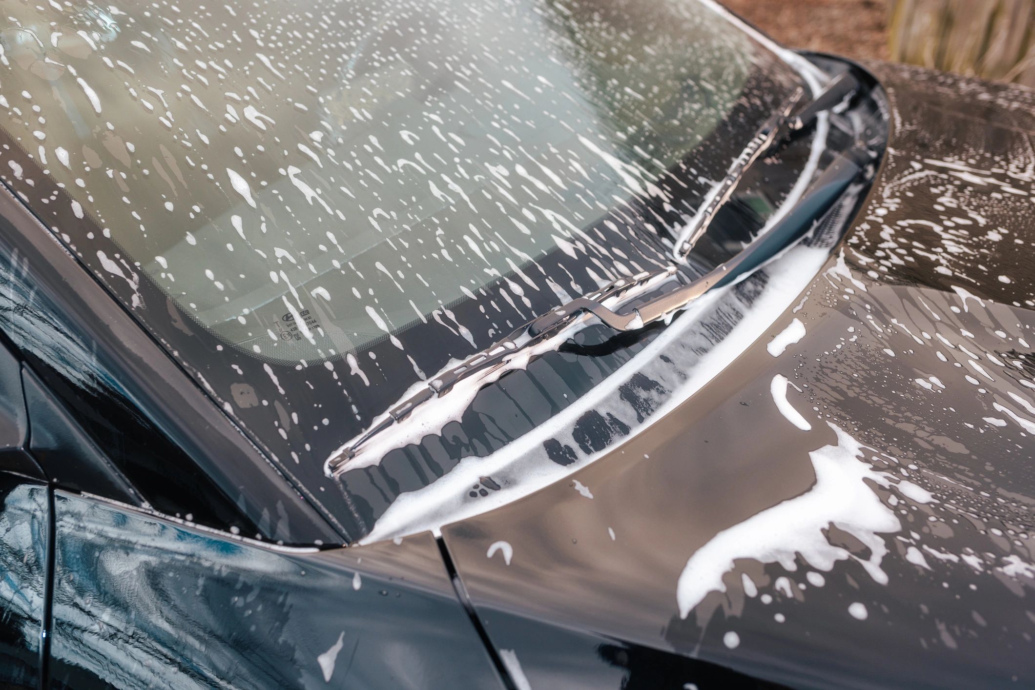 Close-up of windshield during a car wash