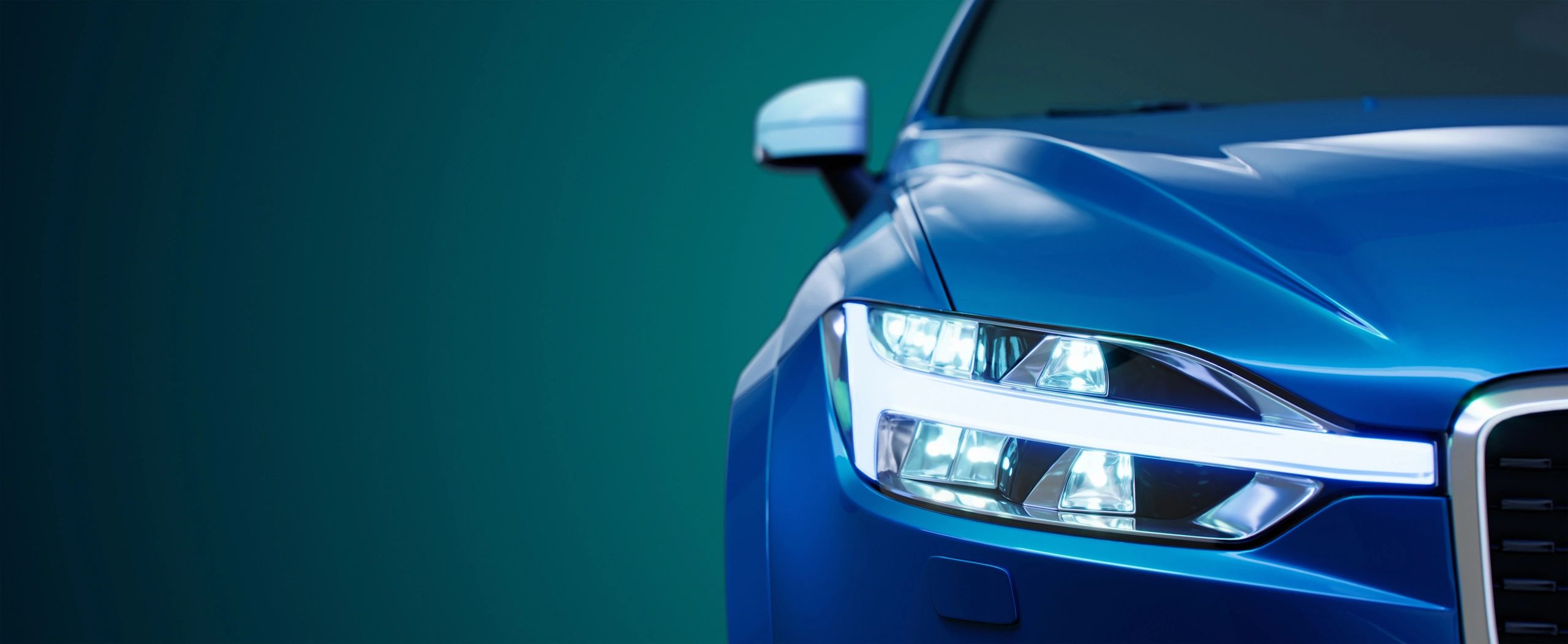 Close-up of a modern car headlight with glossy finish