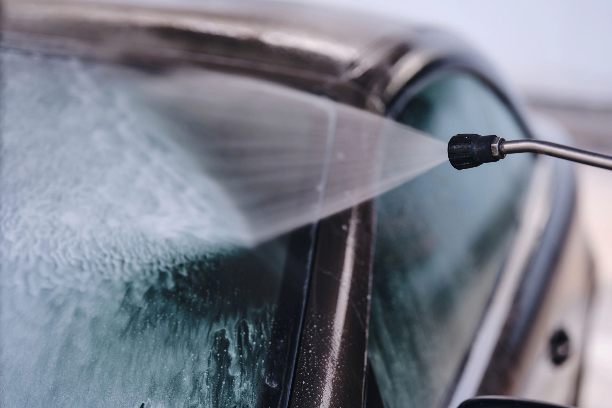 Close-up of car wash foam and water