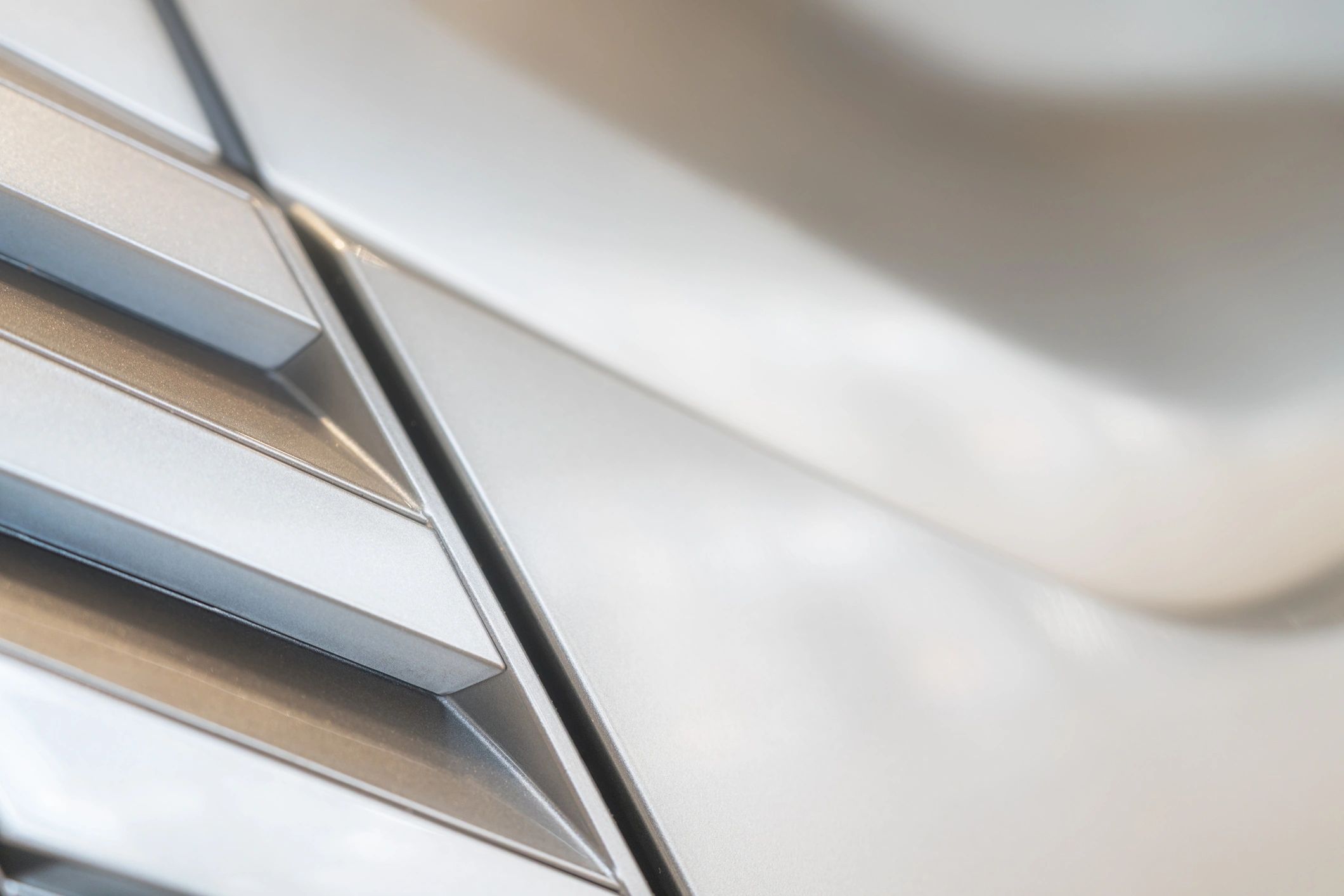 Abstract close-up of sleek metallic surface