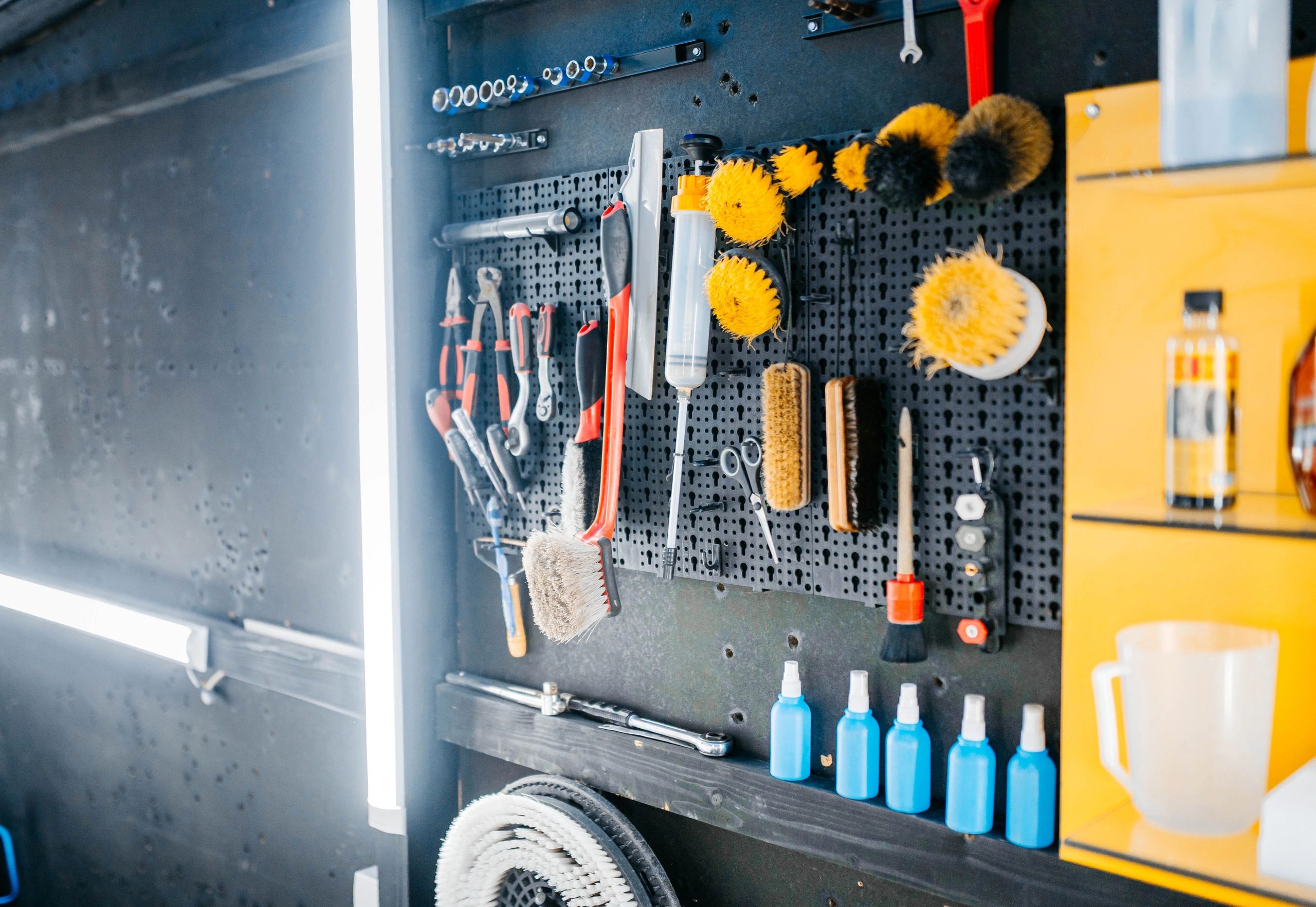 Detailing professional cleaning a vehicle interior
