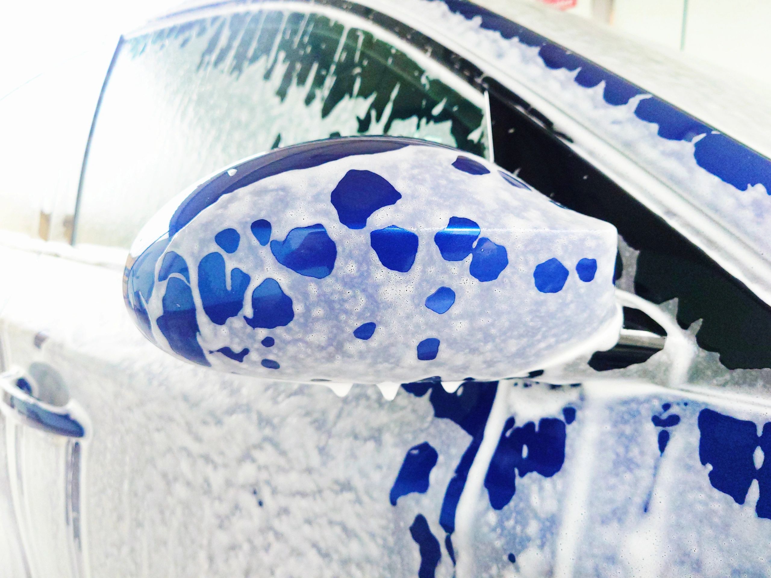 Car covered in foam during wash
