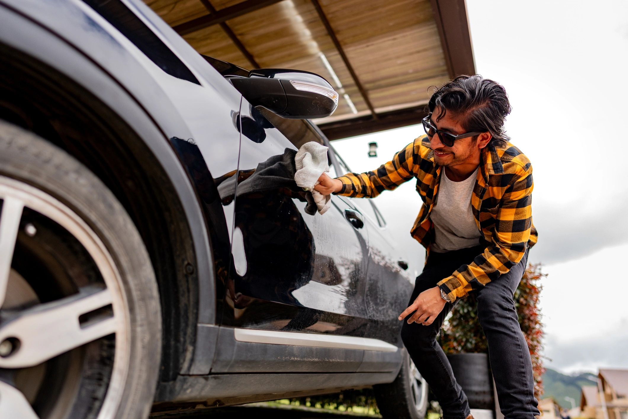 Wiping down a vehicle during a professional detail